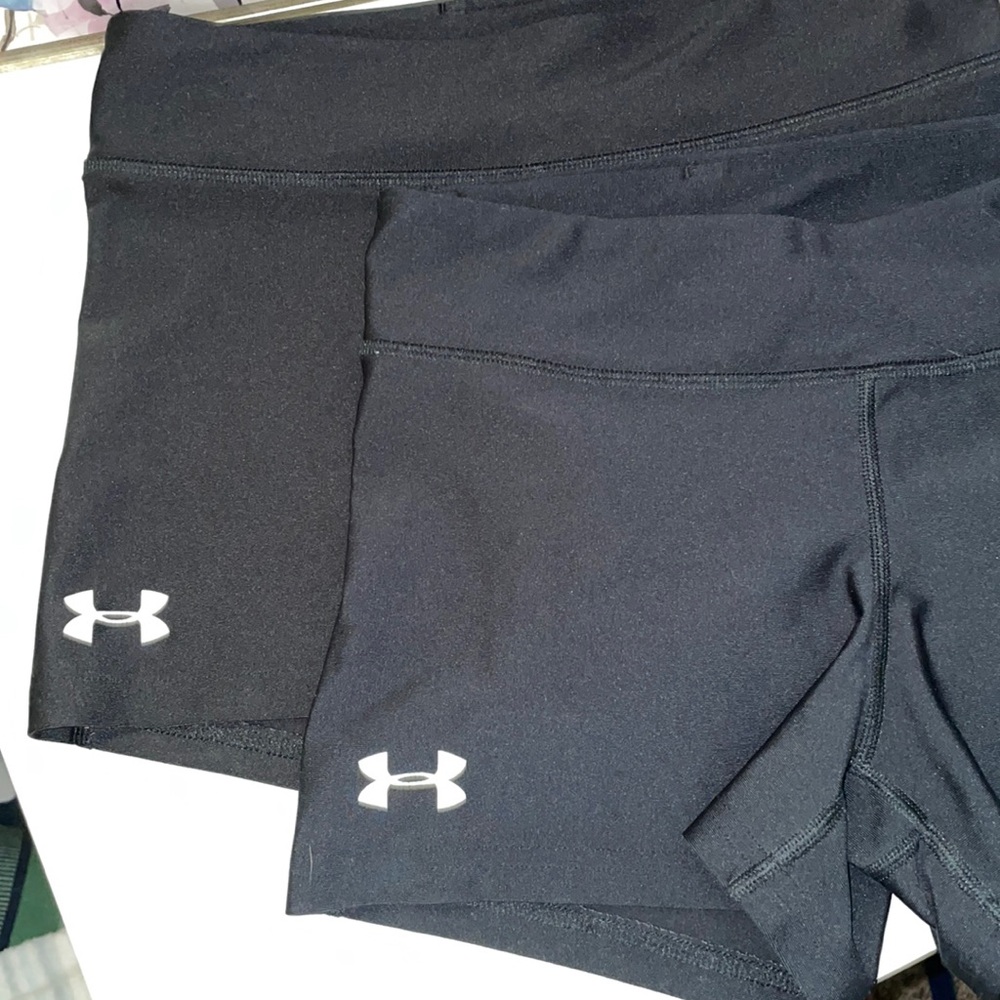 two pair of under armour spandex.